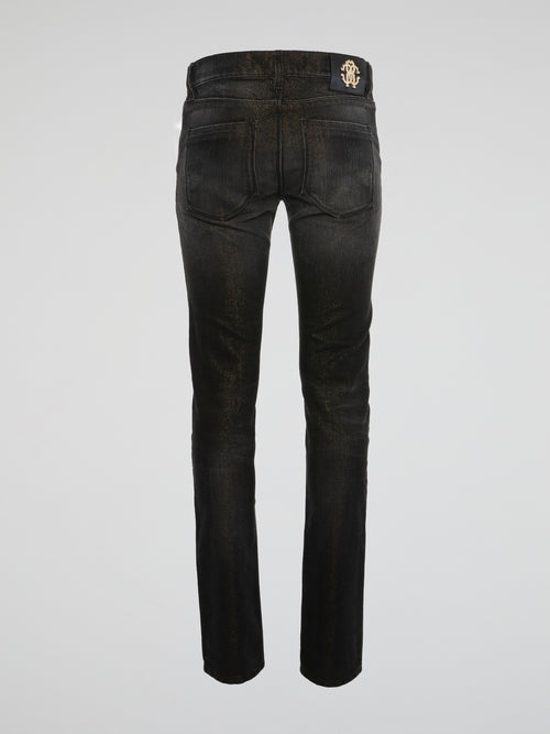 Unleash your inner rockstar with these edgy black acid wash skinny jeans from Roberto Cavalli. The unique acid wash finish adds a rebellious vibe to a classic silhouette, perfect for standing out in a crowd. Elevate your style game and turn heads wherever you go with these statement-making jeans.