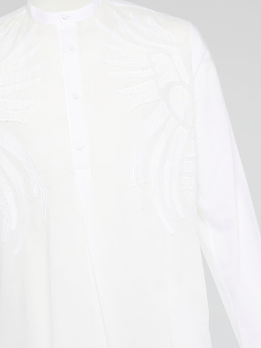Elevate your style with the White Embroidered Mandarin Collar Shirt from Roberto Cavalli, a versatile piece that combines elegance and sophistication. The intricate embroidery and mandarin collar detail add a touch of luxury, making this shirt a standout addition to your wardrobe. Embrace your individuality and make a statement with this unique and timeless piece that is sure to turn heads wherever you go.