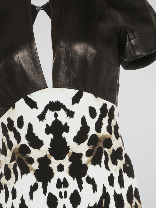 Make a fierce fashion statement with this Animal Print Leather Panel Dress by Roberto Cavalli. Unleash your inner wild side with its daring leopard print design, combined with luxurious leather panels that exude confidence and allure. This stunning dress combines elegance and edginess, making it the perfect choice for any glamorous occasion.