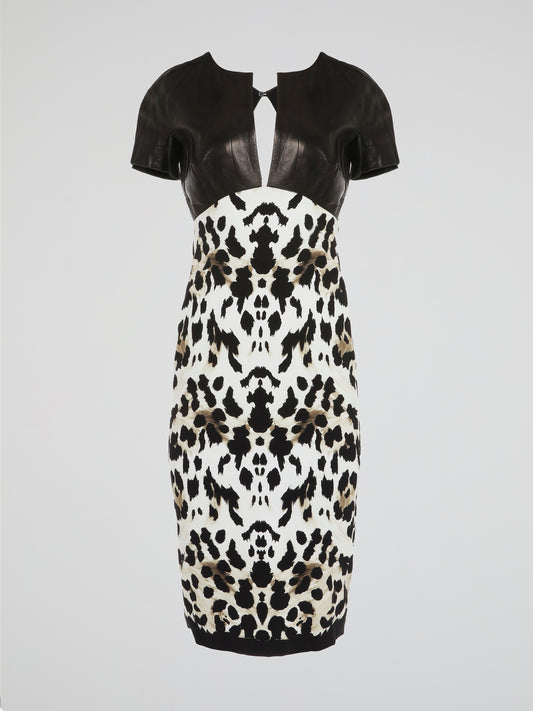 Make a fierce fashion statement with this Animal Print Leather Panel Dress by Roberto Cavalli. Unleash your inner wild side with its daring leopard print design, combined with luxurious leather panels that exude confidence and allure. This stunning dress combines elegance and edginess, making it the perfect choice for any glamorous occasion.