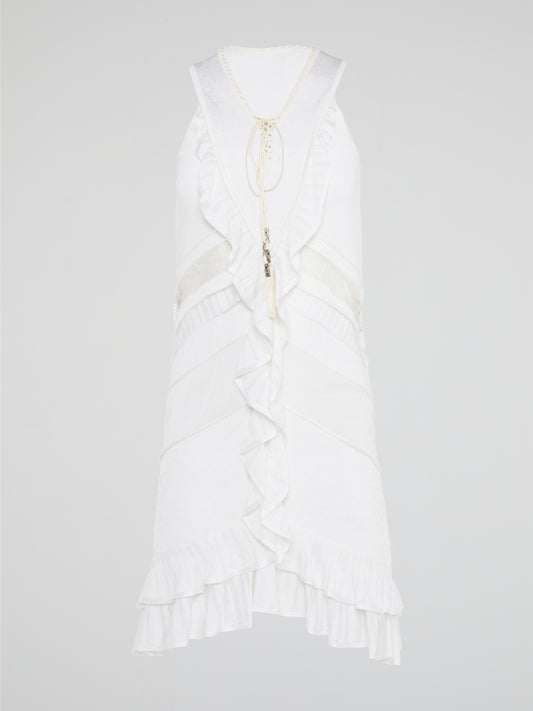 The White Ruffle Dress by Roberto Cavalli will transport you to dreamy summer nights with its ethereal charm. Crafted with intricate layers of delicate ruffles, this dress effortlessly merges elegance with playfulness. From a casual garden party to a glamorous evening soirée, this dress is guaranteed to turn heads and make you feel like a true goddess.