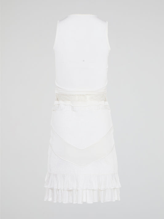 The White Ruffle Dress by Roberto Cavalli will transport you to dreamy summer nights with its ethereal charm. Crafted with intricate layers of delicate ruffles, this dress effortlessly merges elegance with playfulness. From a casual garden party to a glamorous evening soirée, this dress is guaranteed to turn heads and make you feel like a true goddess.