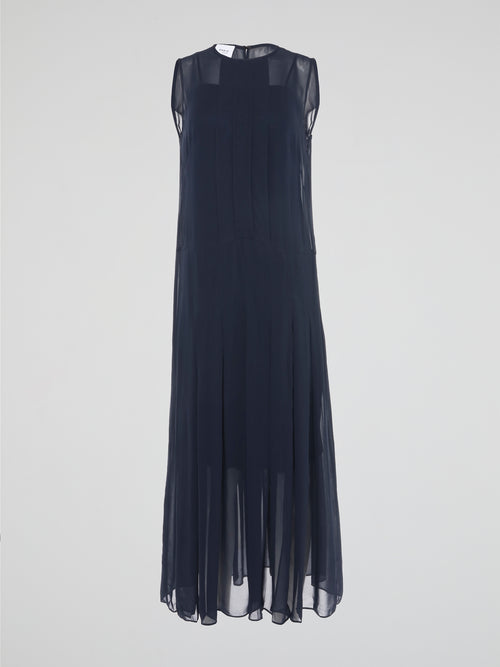 Step into elegance and grace with our Navy Pleated Maxi Dress from Akris Punto. Crafted with meticulous attention to detail, this dress showcases a flattering pleated design that beautifully flows with every step. Perfect for both formal occasions and casual outings, it's time to make a statement and be the epitome of sophistication.