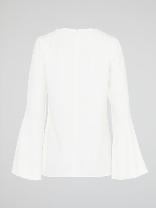 Elevate your everyday look with the White Flared Sleeve Top by Akris Punto. This contemporary and chic piece features unique flared sleeves that add a playful twist to your outfit. Made with high-quality materials, this top guarantees comfort and style, making it a must-have addition to your wardrobe.