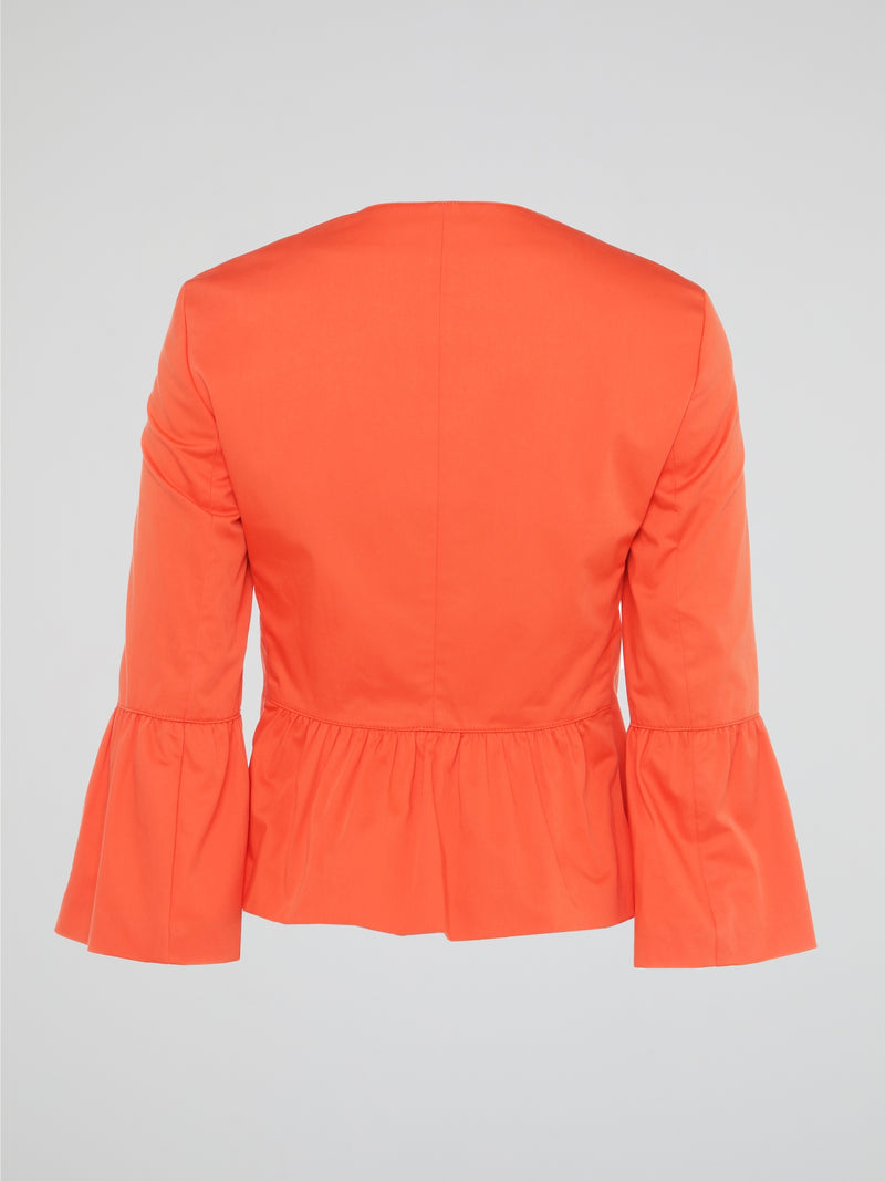 Step into the vibrant world of fashion with our Orange Flared Cuff Top by Akris Punto. This striking masterpiece will make you the center of attention, combining clean lines with an audacious pop of color. The flared cuffs add a playful touch, elevating your style to new heights while bringing out your inner confidence.