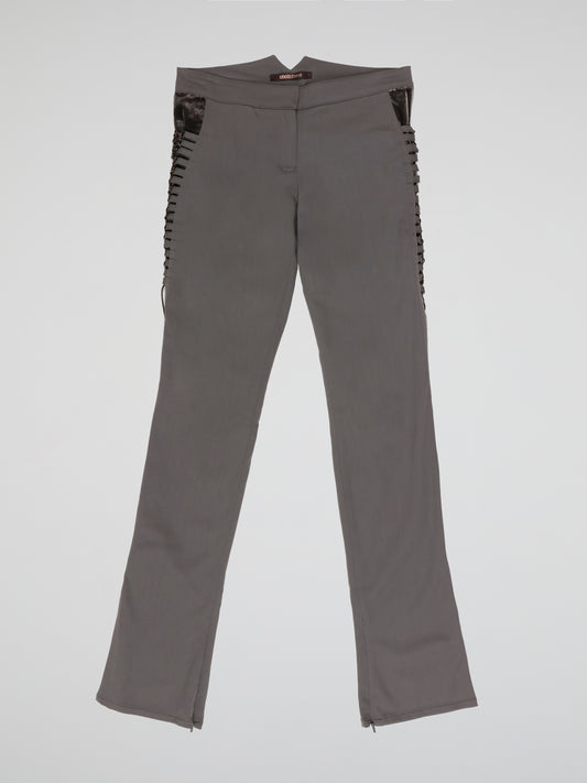 Step up your style game with these Grey Embellished Trousers from Roberto Cavalli - a perfect blend of elegance and edginess. The intricate embellishments add a touch of glamour to the classic grey hue, while the tailored fit ensures a flattering silhouette. Whether it's a formal event or a night out on the town, these trousers are sure to make a statement and leave a lasting impression.