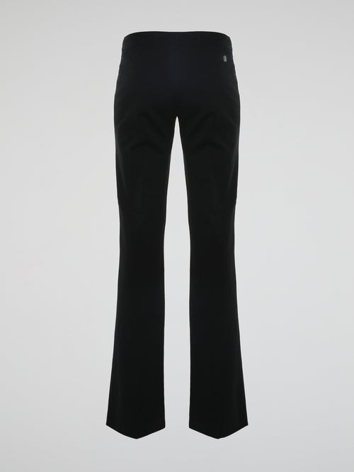 Step into the world of effortless glamour with these Black Flared Trousers by Roberto Cavalli. Crafted with meticulous precision, these trousers boast a striking silhouette that elegantly skims the figure, accentuating every curve. From the office to a night out, these trousers are a timeless wardrobe staple designed to make a bold fashion statement.