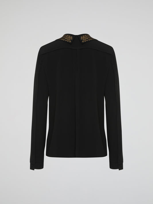 Step into the world of fierce elegance with the Black Studded Collar Blouse by Roberto Cavalli. This extraordinary piece effortlessly combines edgy appeal with timeless sophistication, making it a versatile addition to any wardrobe. With its luxurious fabric, daring studded collar, and impeccable craftsmanship, this blouse is a bold statement that exudes confidence and pushes boundaries.