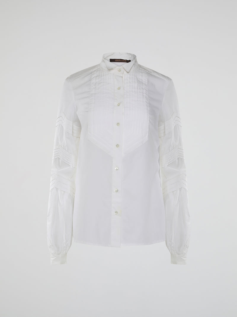 Step into the world of timeless elegance with the White Pleated Bib Shirt from Roberto Cavalli. Crafted with meticulous attention to detail, this masterpiece combines effortless sophistication with a touch of whimsical charm. From its delicate pleated bib to its crisp white fabric, this shirt will make a statement in any setting, exuding refined elegance that is truly captivating.