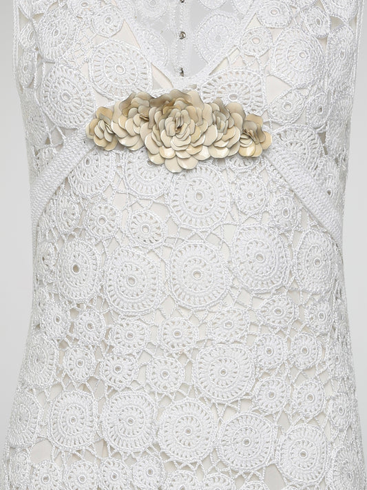 Step into the world of exquisite elegance with this captivating White Crochet Dress by Roberto Cavalli. Crafted with meticulous attention to detail, this dress channels the essence of femininity, showcasing delicate crochet patterns that gracefully embrace your silhouette. Whether you're attending a garden soiree or a beachfront dinner, this dress effortlessly combines timeless charm with modern flair, making you the epitome of effortless beauty.