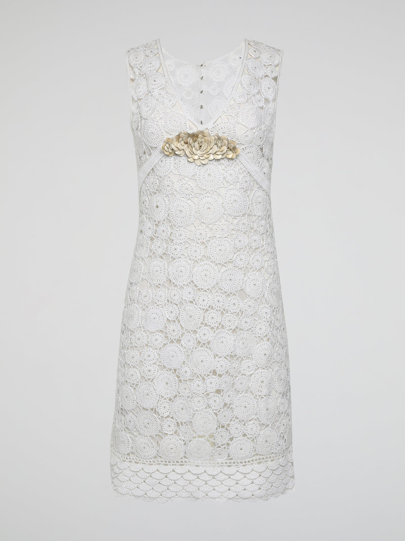 Step into the world of exquisite elegance with this captivating White Crochet Dress by Roberto Cavalli. Crafted with meticulous attention to detail, this dress channels the essence of femininity, showcasing delicate crochet patterns that gracefully embrace your silhouette. Whether you're attending a garden soiree or a beachfront dinner, this dress effortlessly combines timeless charm with modern flair, making you the epitome of effortless beauty.