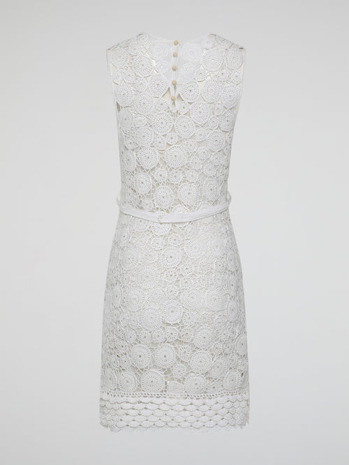 Step into the world of exquisite elegance with this captivating White Crochet Dress by Roberto Cavalli. Crafted with meticulous attention to detail, this dress channels the essence of femininity, showcasing delicate crochet patterns that gracefully embrace your silhouette. Whether you're attending a garden soiree or a beachfront dinner, this dress effortlessly combines timeless charm with modern flair, making you the epitome of effortless beauty.