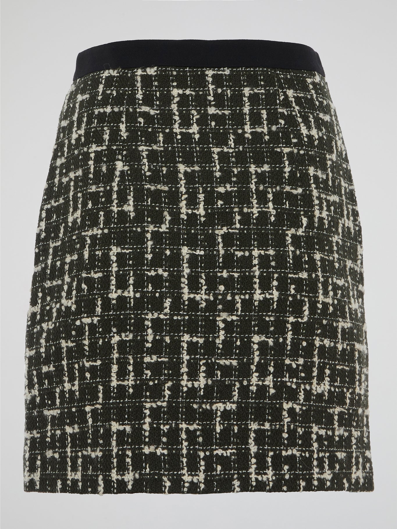 Step into the world of elegance and sophistication with the Tweed Mini Skirt by Emanuel Ungaro. Crafted with the utmost care, this skirt effortlessly fuses timeless style with a contemporary edge. From office meetings to evening soirees, embrace your inner fashionista and make a statement wherever you go with this iconic piece.