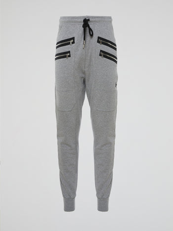 Introducing the Grey Zipper Detailed Sweatpants designed by the visionary fashion guru Markus Lupfer. These sweatpants are the epitome of comfort with a luxurious twist. With their unique zipper detailing, they effortlessly merge style and functionality, making them the ideal companion for both lounging at home and making a bold fashion statement on the streets.