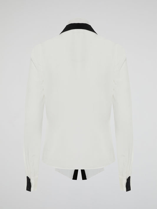Introducing the White Contract Detailed Shirt by Emanuel Ungaro - a symphony of sophistication and style. Crafted with meticulous attention to detail, this shirt embodies elegance with its intricate contract stitching, adding a touch of modernity to a classic design. Perfect for the discerning gentleman who seeks to make a bold and refined statement, this shirt is the epitome of luxury fashion.