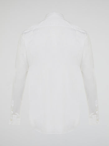 Step into a realm of elegance with the White Embroidered Shirt by Roberto Cavalli, where classic sophistication meets modern charm. Crafted with meticulous attention to detail, this shirt showcases exquisite floral embroidery that dances gracefully across the pristine white fabric. Embrace your inner fashion icon as you effortlessly blend timeless style with a touch of Italian flair, making a statement that is as timeless as it is enchanting.