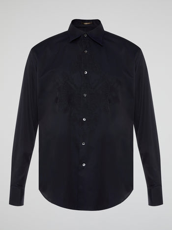 Step into the realm of effortless elegance with the captivating Black Embroidered Shirt by Roberto Cavalli. Adorned with intricate embroidery and delicate lace details, this shirt is a mesmerizing fusion of sophistication and sensuality. Elevate your style with this statement piece that exudes an air of mystique and timeless allure.