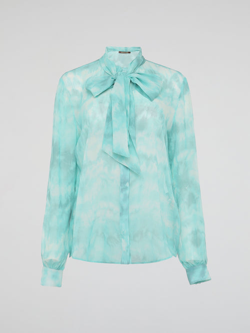 Embrace a vibrant and eco-friendly fashion statement with our Green Tie Dye Blouse by Roberto Cavalli. Crafted with exquisite attention to detail, this unique piece seamlessly combines the timeless elegance of a blouse with the bold and playful allure of tie-dye. Whether you're strolling through a music festival or elevating your everyday style, this blouse promises to make a head-turning statement, while embracing sustainable fashion.