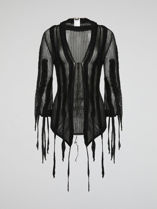 Wrap yourself in luxurious style with the Roberto Cavalli Black Mesh Cardigan. Made from lightweight, breathable mesh fabric, this cardigan is perfect for layering year-round. The intricate black mesh design adds a touch of edgy sophistication to any outfit.