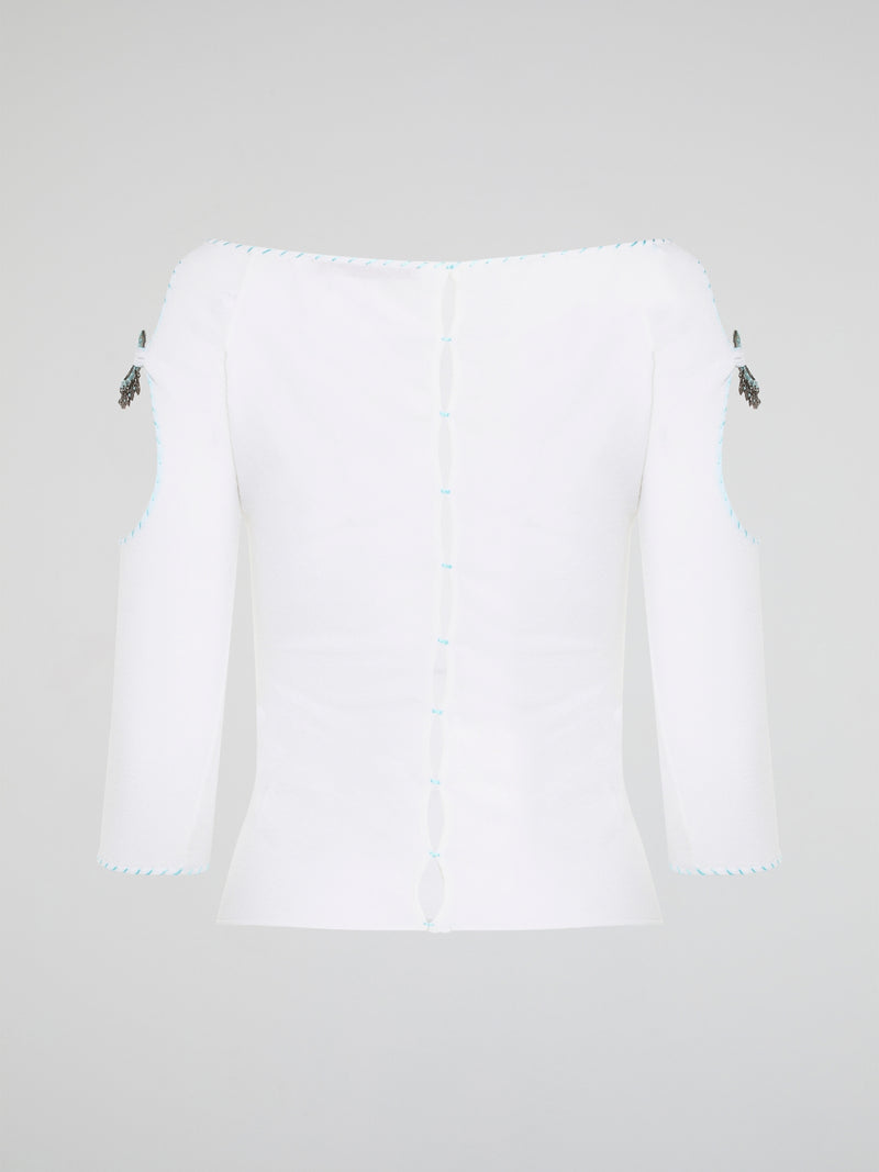 Elevate your everyday wardrobe with this stunning White Cut Out Top from Roberto Cavalli. Crafted from luxurious, high-quality materials, this top features intricate cut out detailing that adds a touch of edge and sophistication to any outfit. Perfect for day or night, this versatile piece is a must-have addition to your fashion collection.