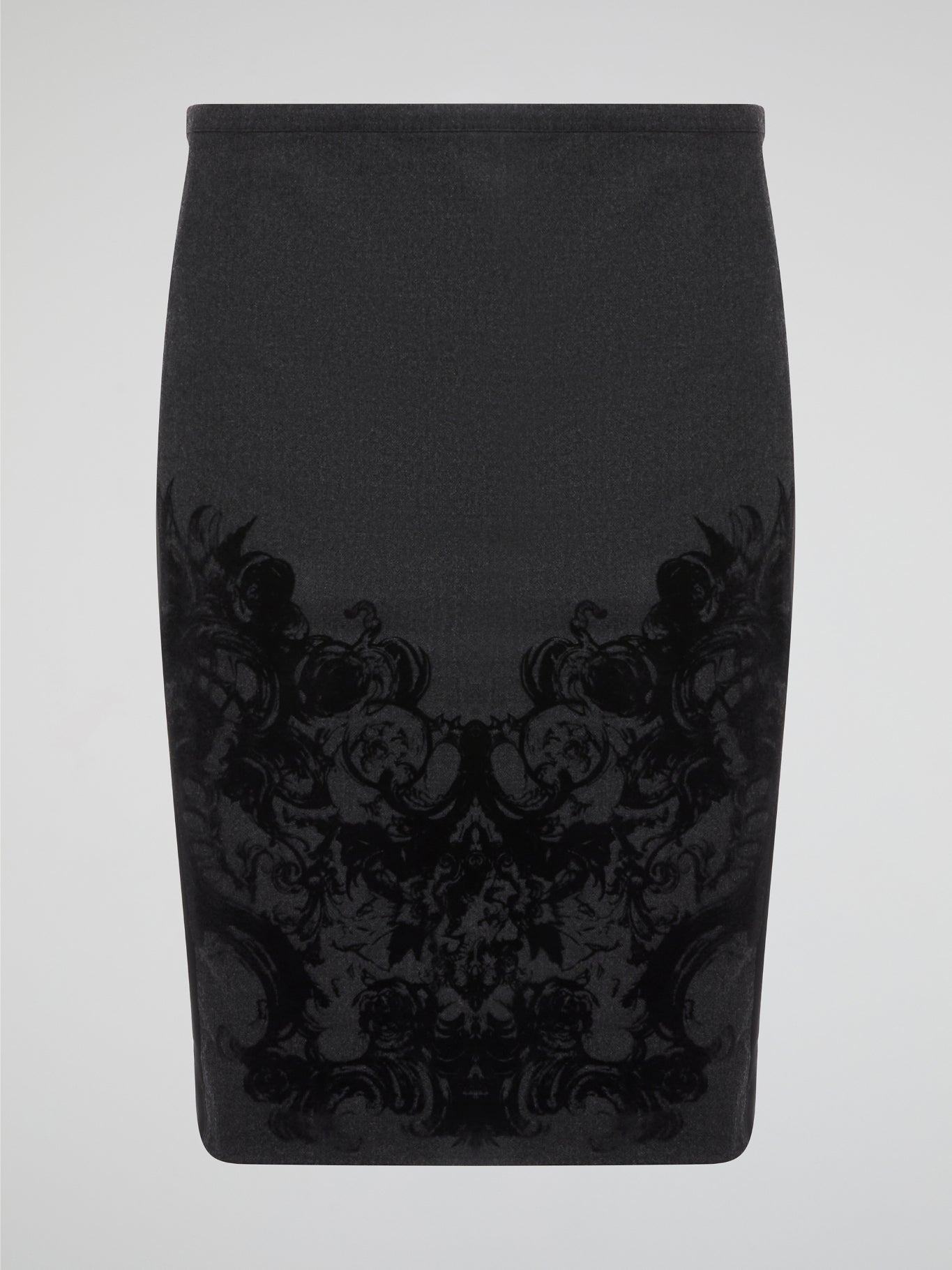 Elevate your office attire with this stunning grey printed pencil skirt from iconic designer Roberto Cavalli. The intricate pattern adds a touch of sophistication and style, making you stand out from the crowd. Pair it with a crisp white blouse and heels for a polished and fashion-forward look that will turn heads wherever you go.