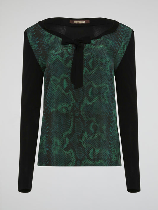 Embrace your wild side with the Reptilian Long Sleeve Top by Roberto Cavalli. Made from luxurious, soft fabric, this top features a mesmerizing reptile print that will turn heads wherever you go. With its chic and edgy design, this top is the perfect statement piece to elevate any outfit.