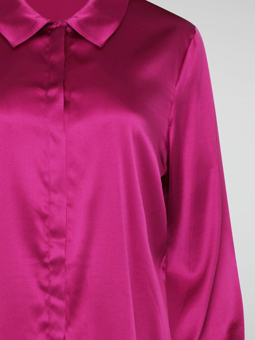 Elevate your wardrobe with this exquisite Pink Long Sleeve Silk Shirt by Roberto Cavalli. Crafted from luxurious silk fabric, this shirt drapes beautifully on the body, creating a sophisticated silhouette. The vibrant pink hue adds a pop of color to any outfit, making it the perfect statement piece for any occasion.