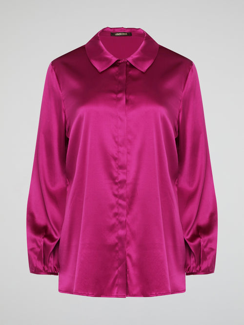 Elevate your wardrobe with this exquisite Pink Long Sleeve Silk Shirt by Roberto Cavalli. Crafted from luxurious silk fabric, this shirt drapes beautifully on the body, creating a sophisticated silhouette. The vibrant pink hue adds a pop of color to any outfit, making it the perfect statement piece for any occasion.