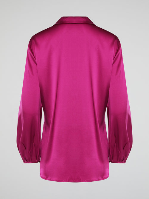 Elevate your wardrobe with this exquisite Pink Long Sleeve Silk Shirt by Roberto Cavalli. Crafted from luxurious silk fabric, this shirt drapes beautifully on the body, creating a sophisticated silhouette. The vibrant pink hue adds a pop of color to any outfit, making it the perfect statement piece for any occasion.