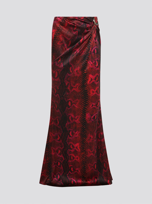 Make a fierce fashion statement with the Red Snake Print Draped Skirt by Roberto Cavalli. This bold and exotic piece features a striking snake print design that will turn heads wherever you go. The draped silhouette adds a touch of drama and sophistication, making it the perfect choice for a night out on the town.