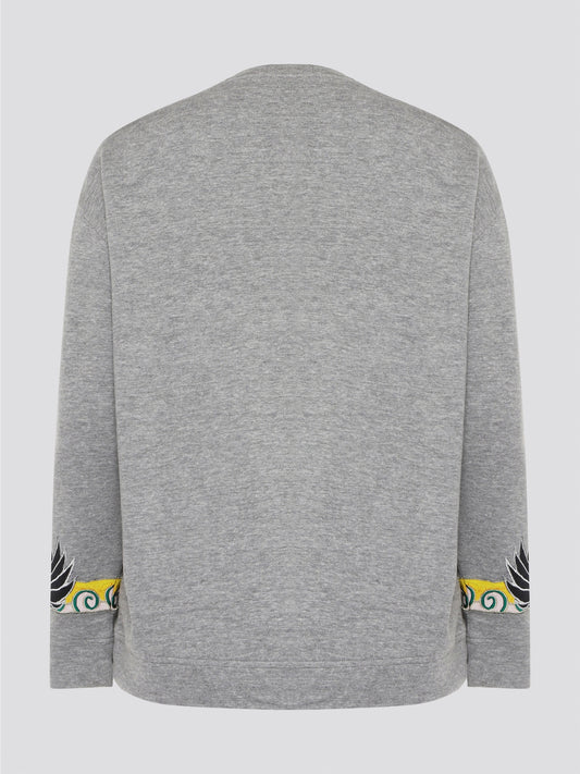 Elevate your casual wardrobe with this effortlessly chic Grey Embroidered Sweatshirt from Roberto Cavalli. Crafted with intricate floral embroidery, this sweatshirt adds a touch of luxury to your everyday look. Pair it with jeans for a stylish and comfortable outfit that will turn heads wherever you go.