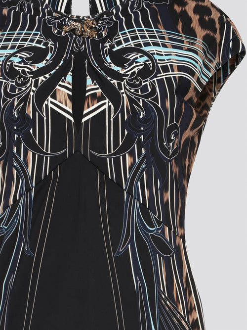 Indulge in pure luxury with the Roberto Cavalli Printed Cap Sleeve Top. Crafted with exquisite attention to detail, this top features a unique print that is bound to turn heads wherever you go. The cap sleeves add a touch of sophistication, making it the perfect statement piece for any fashion-forward individual.