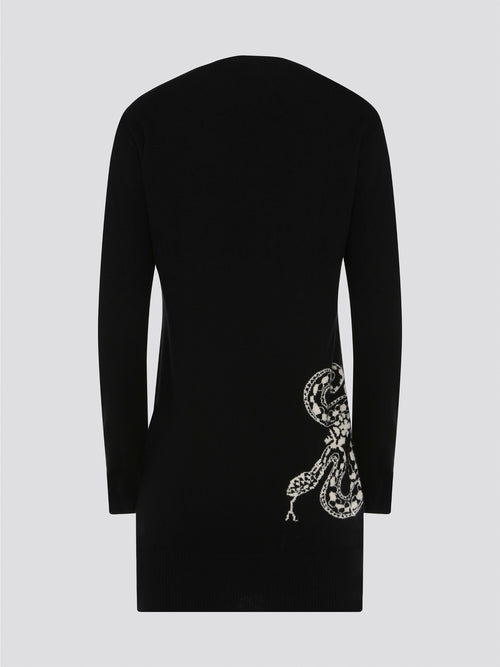 Step out in style and sophistication with this luxurious Black Knitted Sweater Dress by Roberto Cavalli. Crafted from the finest materials, this dress exudes elegance and charm with its intricate knit design and flattering silhouette. Whether for a night out on the town or a cozy evening in, this versatile piece will elevate any look with a touch of Italian glamour.