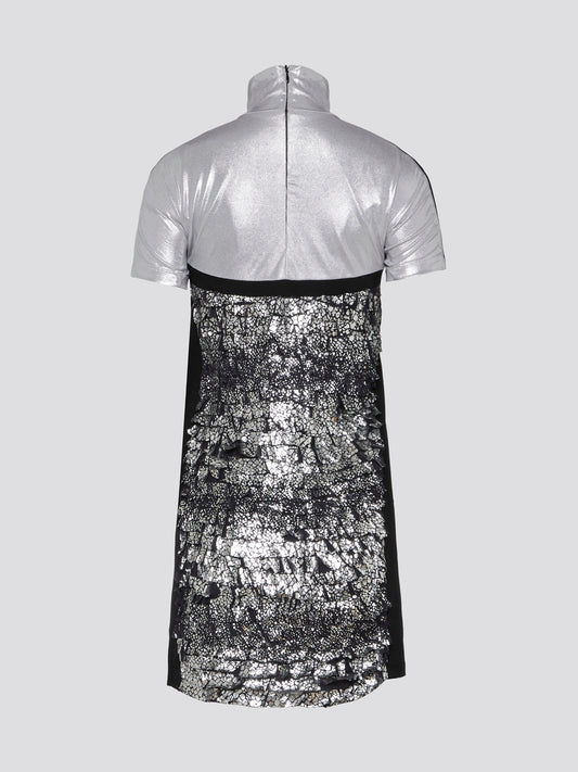 Shimmer and shine in the spotlight with our Metallic Turtleneck Mini Dress by Versus Versace. This show-stopping piece combines edgy fashion with a touch of glamour, perfect for stepping out in style. With its sleek turtleneck and eye-catching metallic finish, you'll be sure to turn heads wherever you go.
