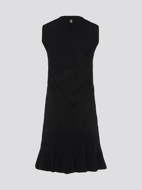 Get ready to turn heads with this stunning black sleeveless mini dress from Roberto Cavalli. This sleek and stylish design features a flattering silhouette that hugs your curves in all the right places. Whether you're hitting the town or attending a special event, this dress is sure to make a statement and elevate your look to the next level.