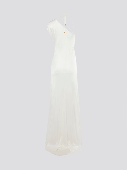 Steal the spotlight in this stunning White Asymmetrical Gown by Roberto Cavalli, perfect for your next glamorous event. With its unique asymmetrical design and flowing silhouette, this gown is sure to turn heads and make you feel like a true fashion icon. Embrace your inner goddess and make a statement in this unforgettable piece that exudes elegance and sophistication.