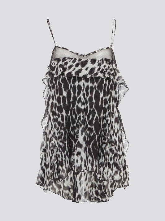 Unleash your wild side with this fierce Leopard Print Chiffon Top by Roberto Cavalli. Made from luxurious chiffon fabric, this top oozes elegance and confidence. Pair it with sleek black pants for a day-to-night look that is sure to turn heads.