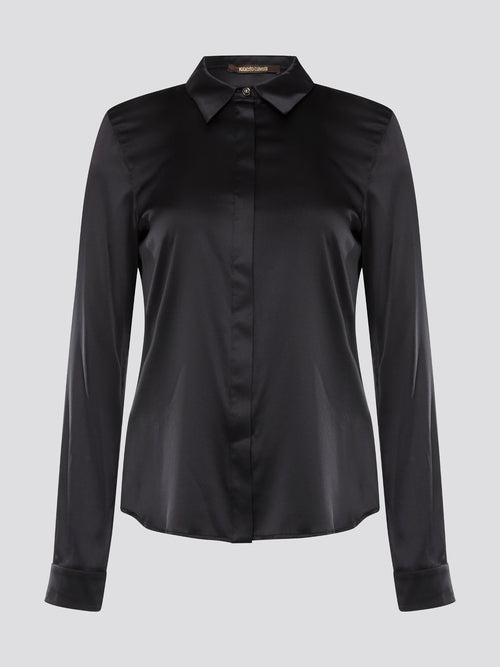 Step out in sleek and sophisticated style with this black satin shirt from Roberto Cavalli, a luxurious addition to your wardrobe. The silky smooth fabric drapes effortlessly, while the tailored fit adds a touch of elegance to any outfit. Perfect for a night out on the town or a special event, this shirt is sure to turn heads and make a statement.