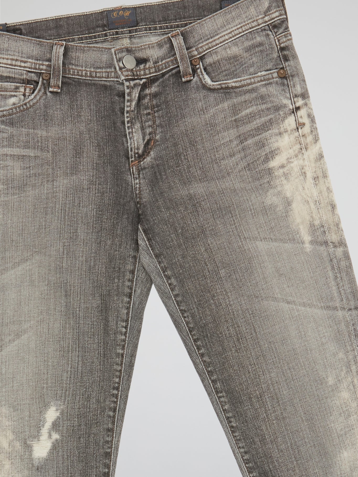 Step up your denim game with our Grey Distressed Denim Jeans from Citizens Of Humanity. Made with premium quality denim and intricate distressing detail, these jeans are perfect for adding a touch of edgy style to any outfit. Whether you're dressing them up or down, these jeans are a must-have staple for any fashion-forward wardrobe.