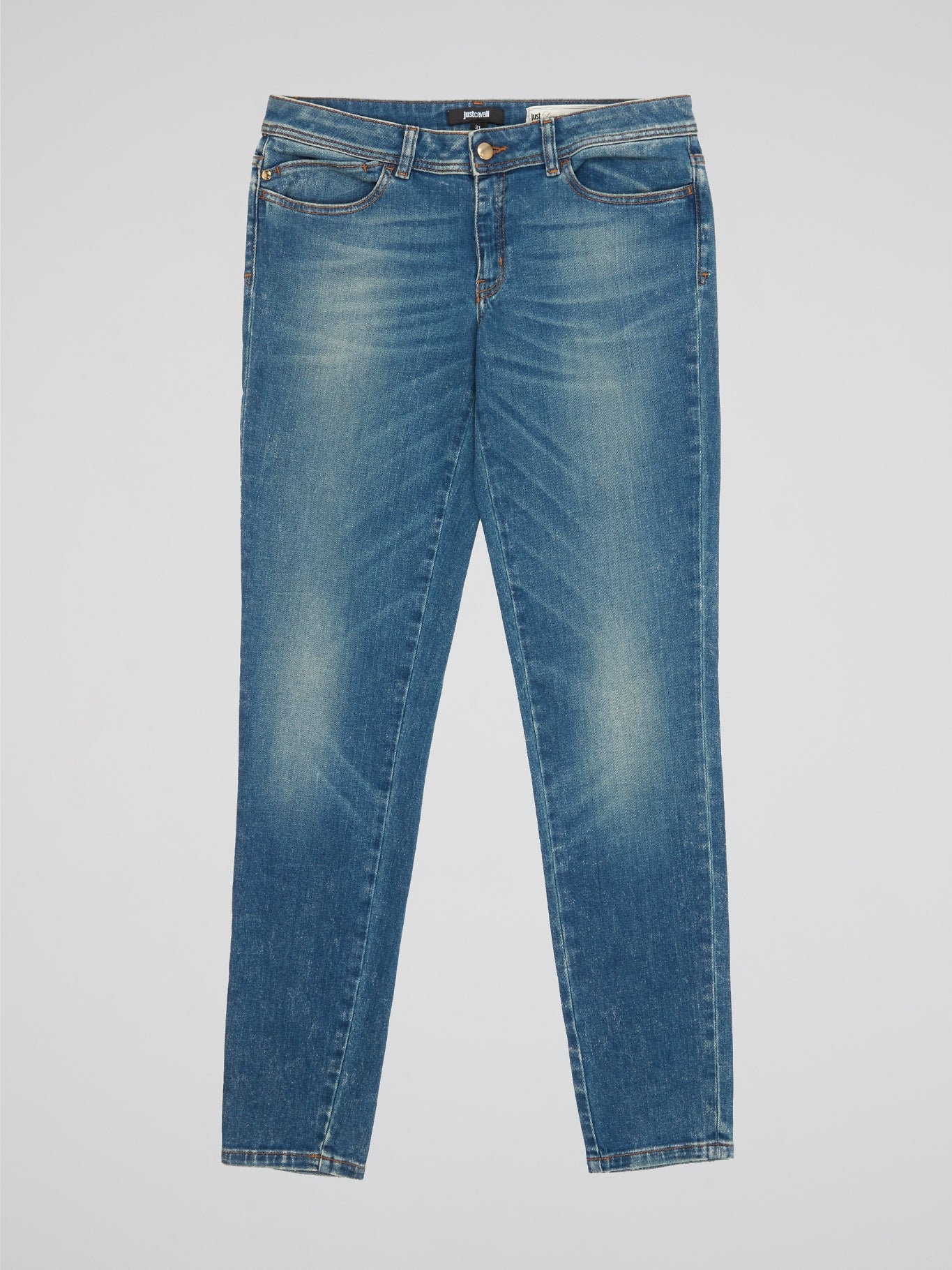 Step out in style with these Just Cavalli stonewashed skinny jeans that are sure to turn heads wherever you go. The unique stonewashed finish adds a trendy vintage vibe to your look, while the skinny fit flatters your figure perfectly. Made with high-quality denim, these jeans are comfortable to wear all day long and are a must-have addition to your wardrobe.