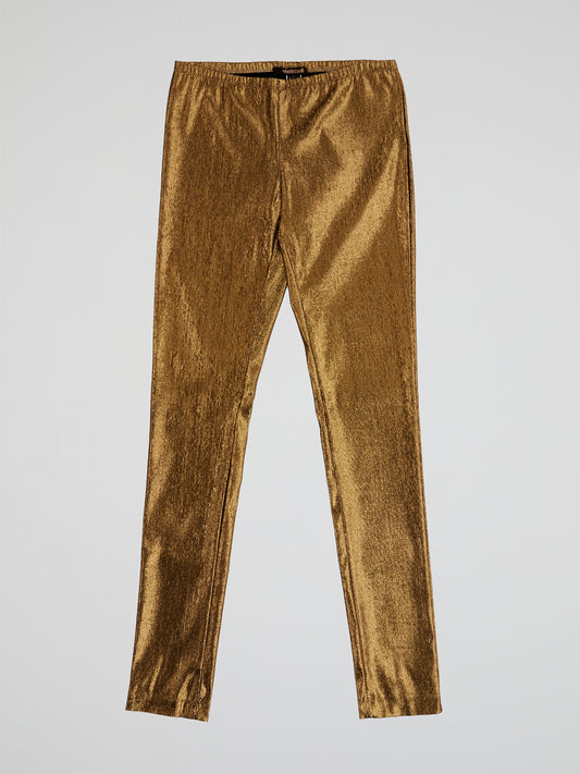 Step up your fashion game with these Roberto Cavalli Gold Elasticated Waist Trousers. The shimmering gold fabric and elasticated waist ensure both style and comfort, making them perfect for a night out or special occasion. Channel your inner glam and stand out from the crowd with these luxurious trousers.