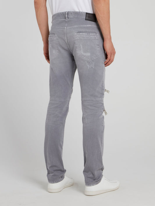 Серые брюки с рваной отделкой и молниями