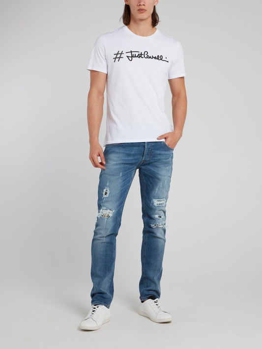 Синие джинсы с рваной отделкой